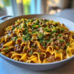 Close-up of One Pan Ground Beef Stroganoff with egg noodles and creamy sauce, garnished with parsley.