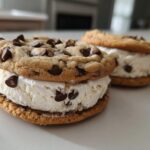 Close-up of two homemade Chocolate Chip Ice Cream Sandwiches made with vanilla ice cream.